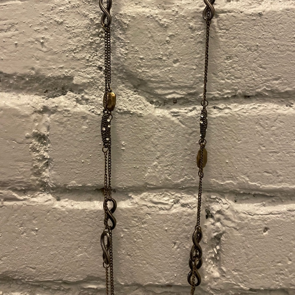 Long Gold necklace with accents.